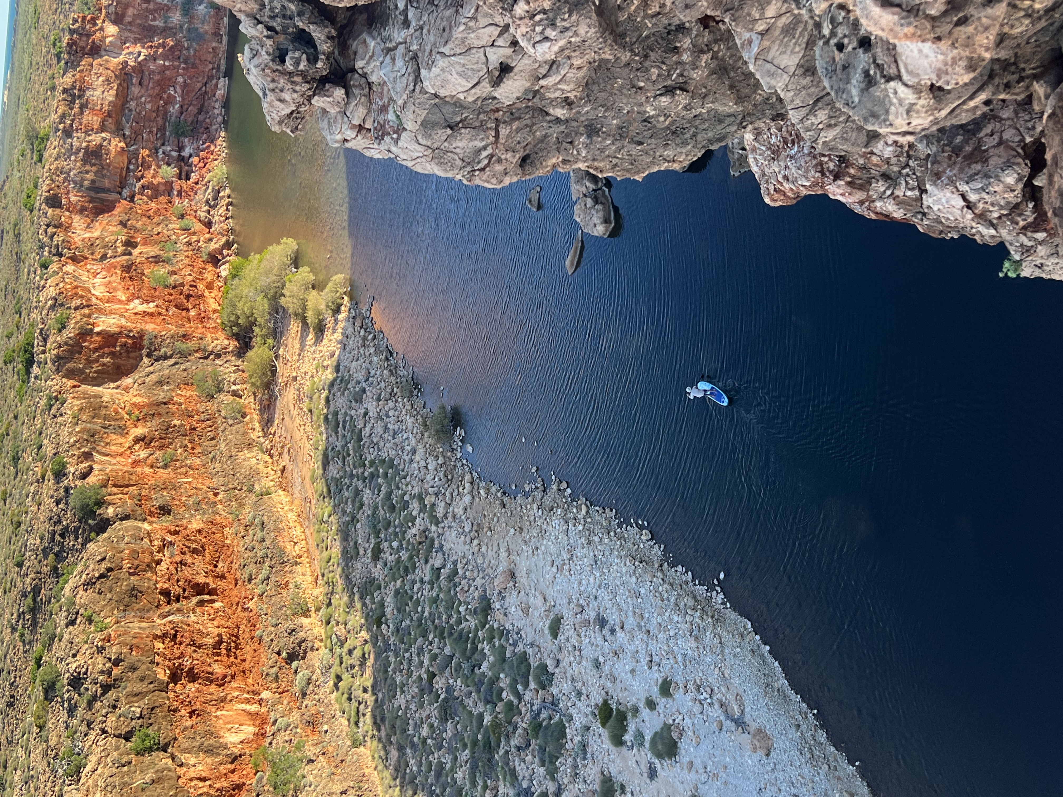 Gorge with deep blue water and red rock walls