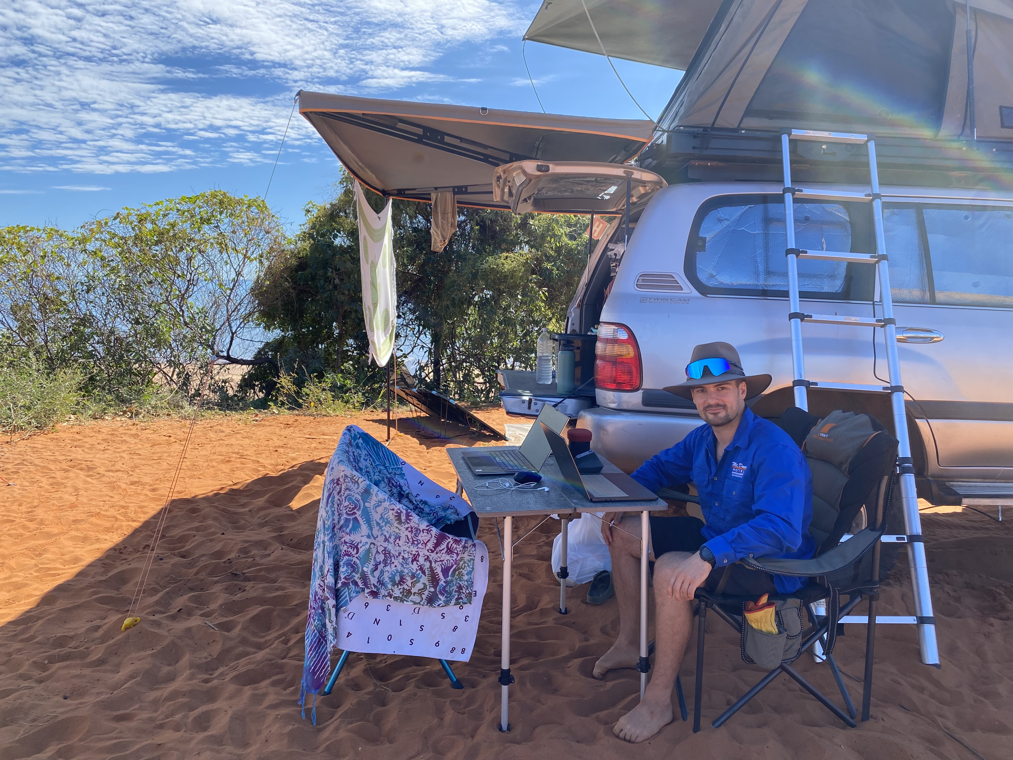 Working from the Landcruiser setup on red sand