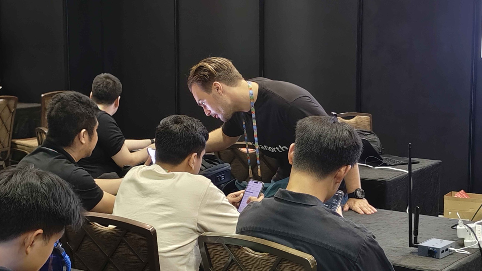 Working one-on-one with workshop participants at the DEF CON Singapore workshop.